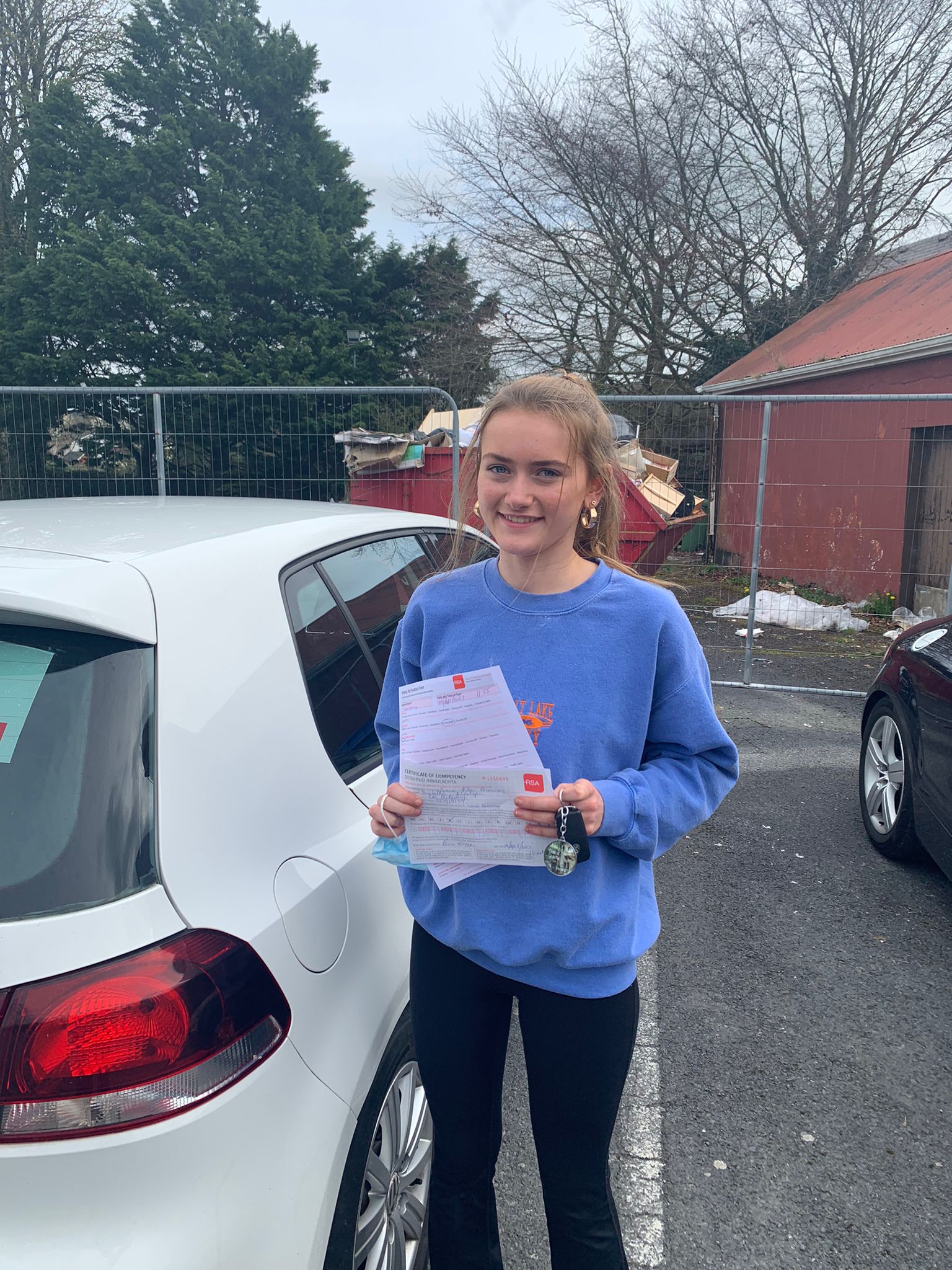 Student with driving test pass certificate