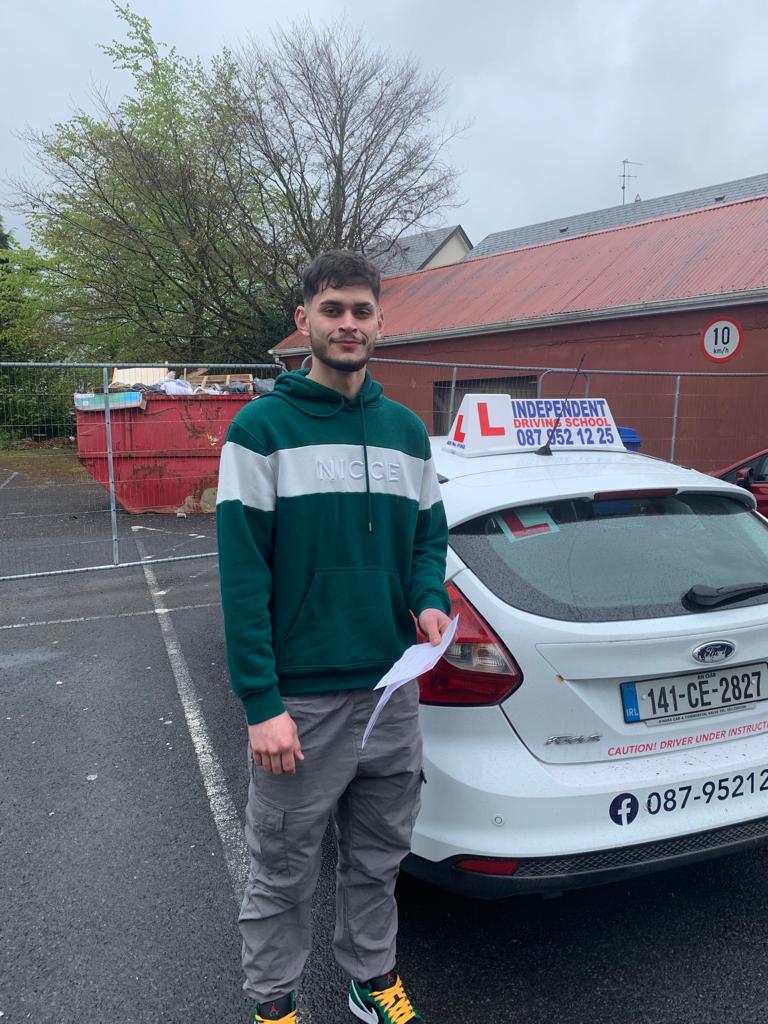 Student with driving test pass certificate