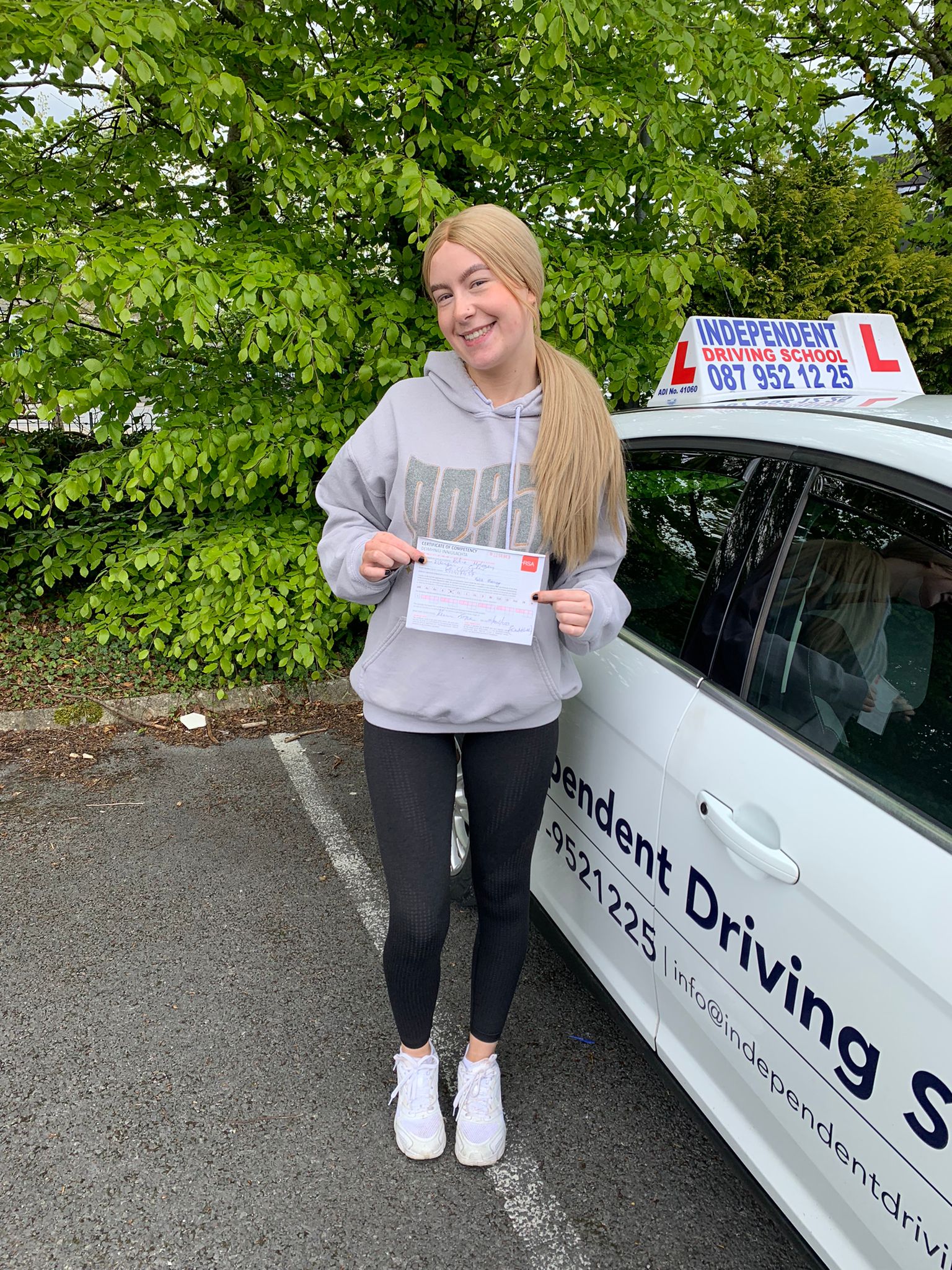 Student with driving test pass certificate
