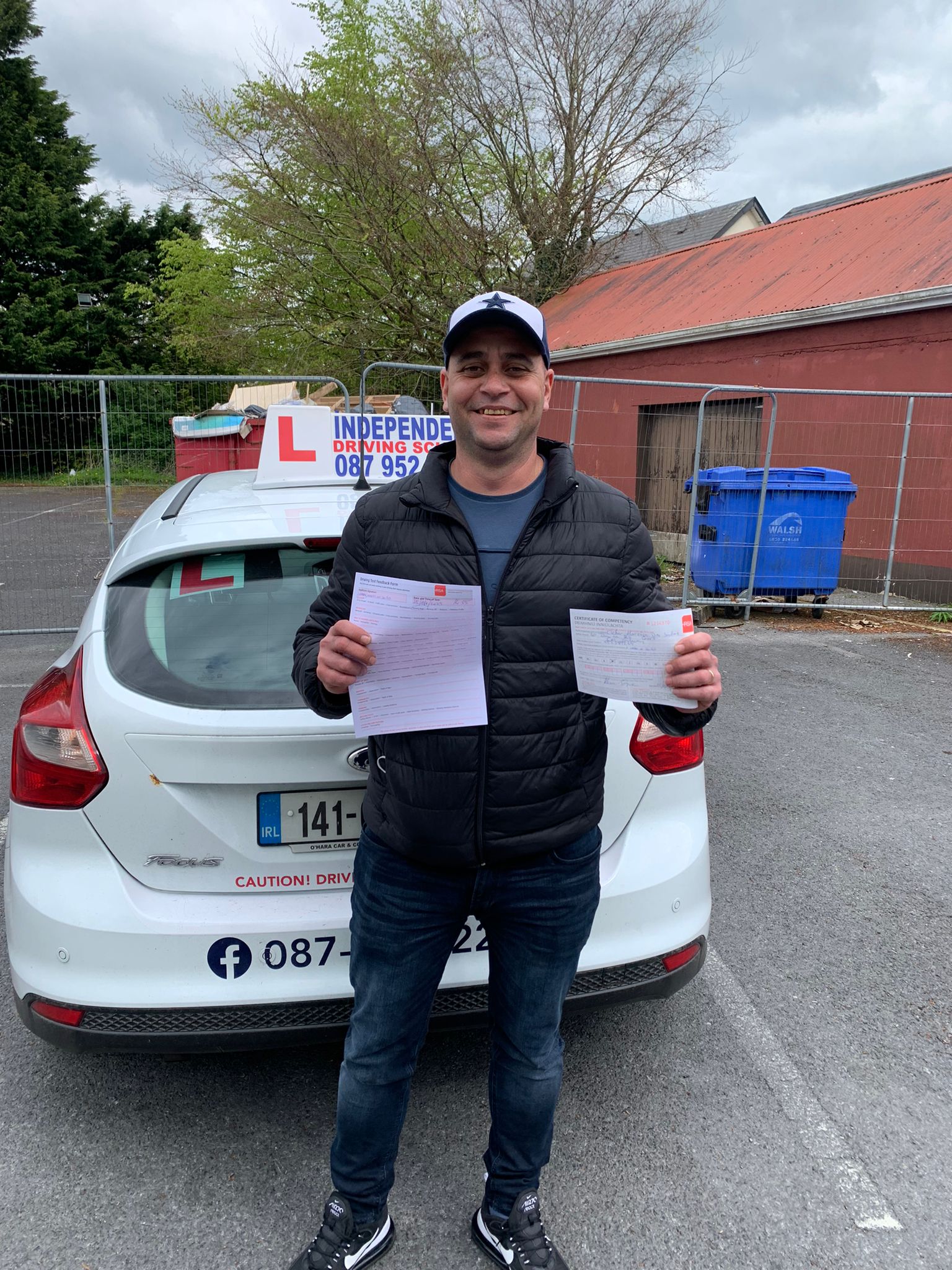 Student with driving test pass certificate