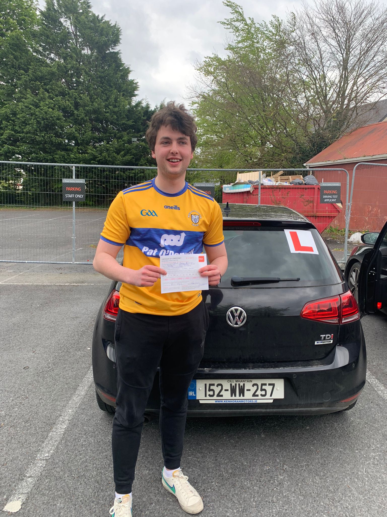 Student with driving test pass certificate