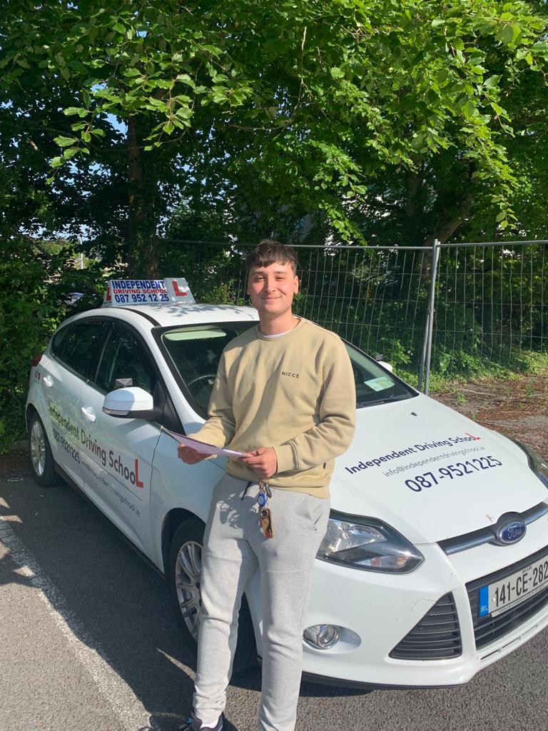 Student with driving test pass certificate