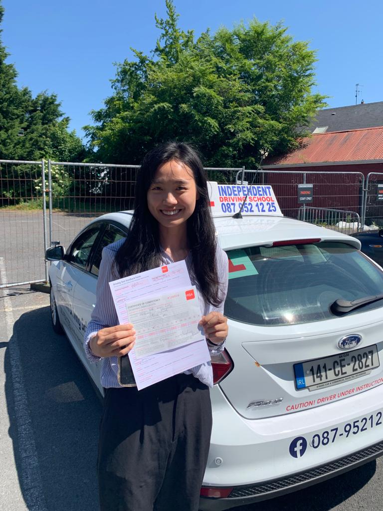 Student with driving test pass certificate