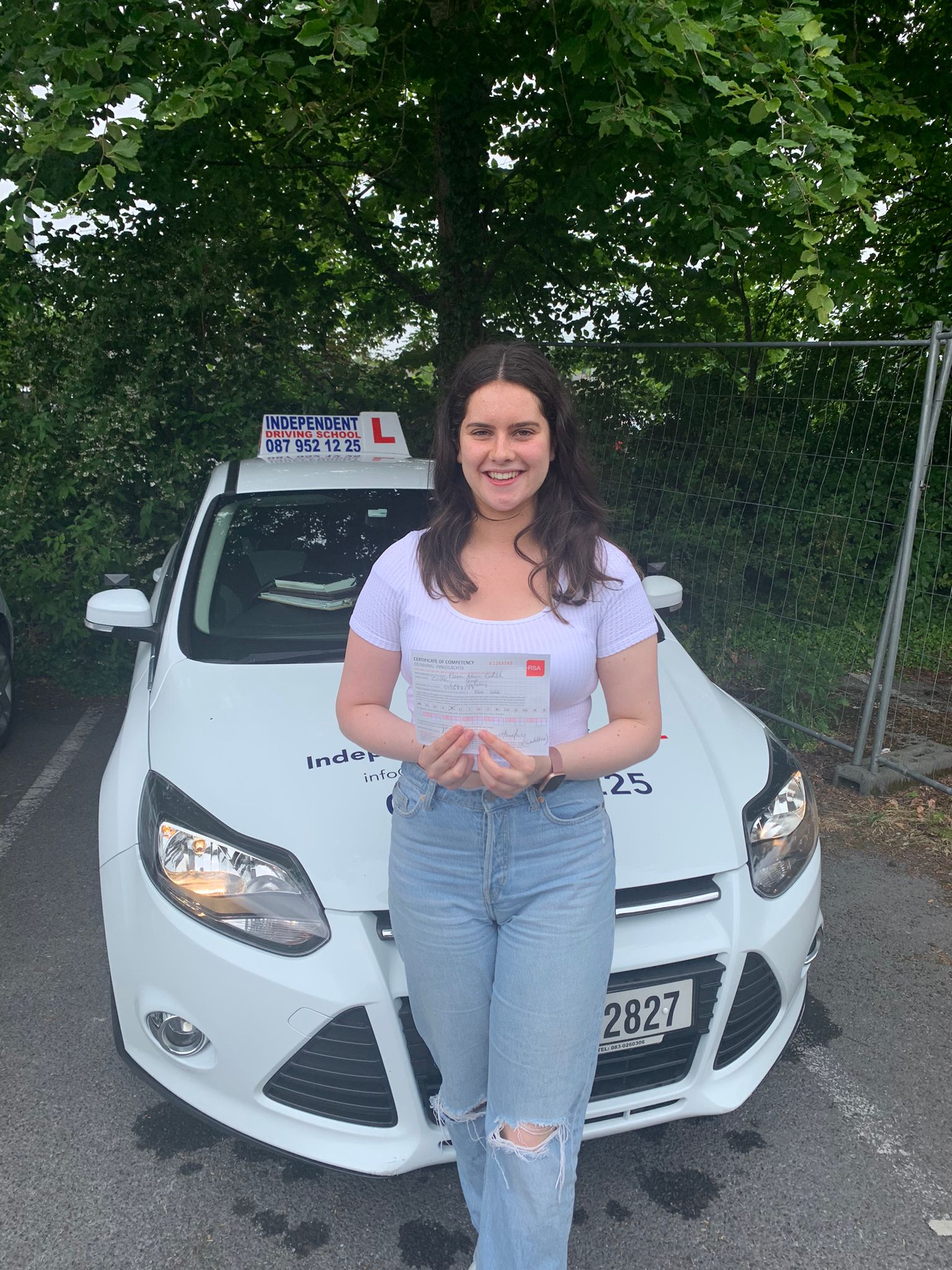 Student with driving test pass certificate