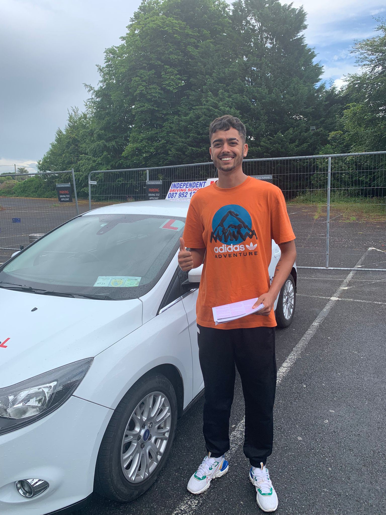 Student with driving test pass certificate
