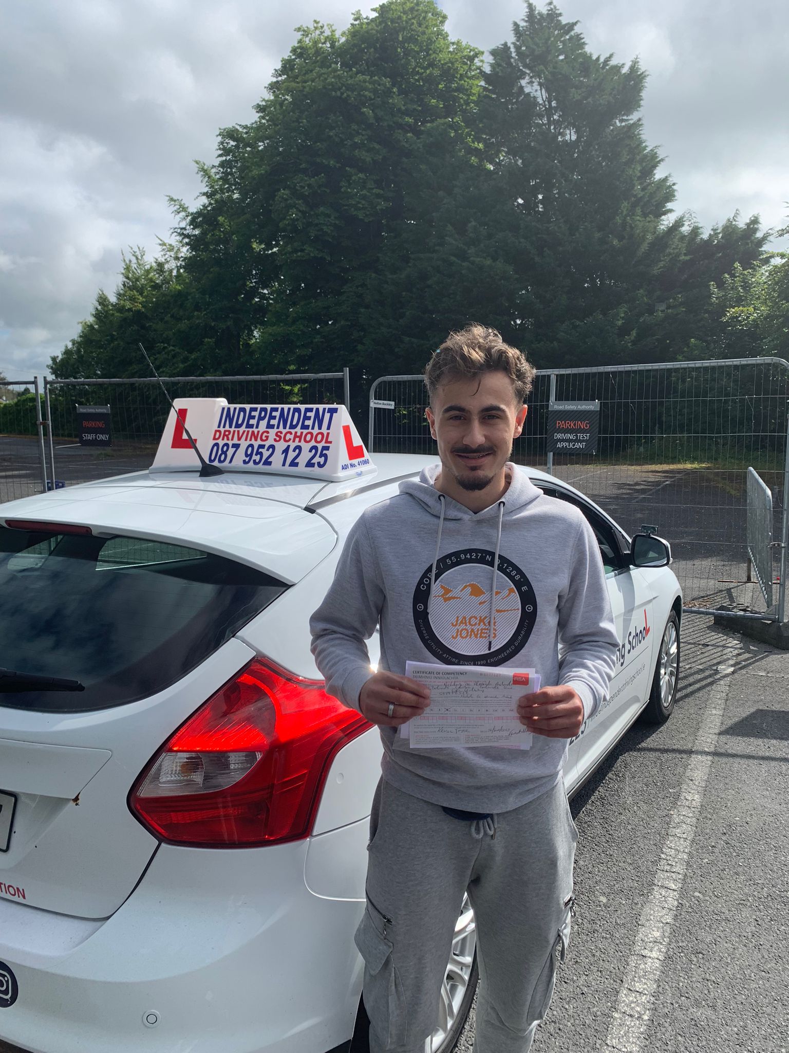 Student celebrating passing their driving test