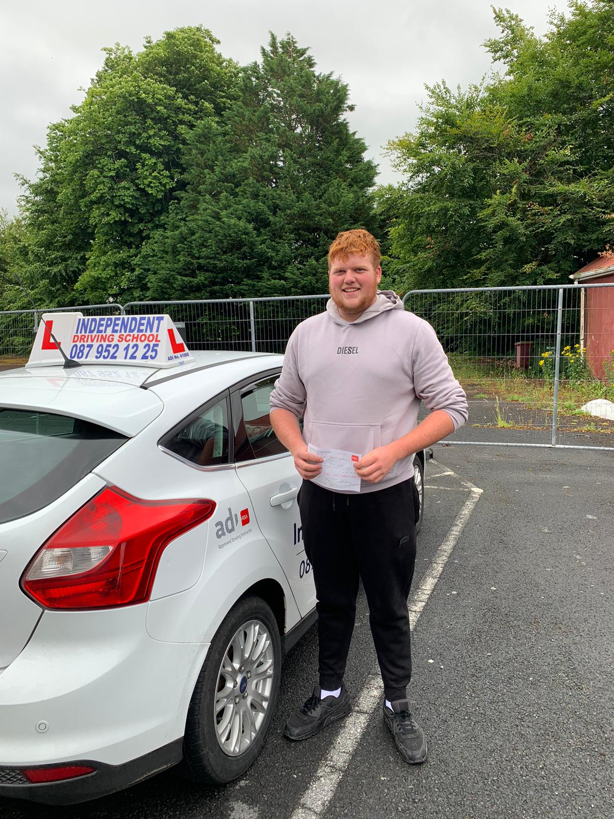 Student with driving test pass certificate