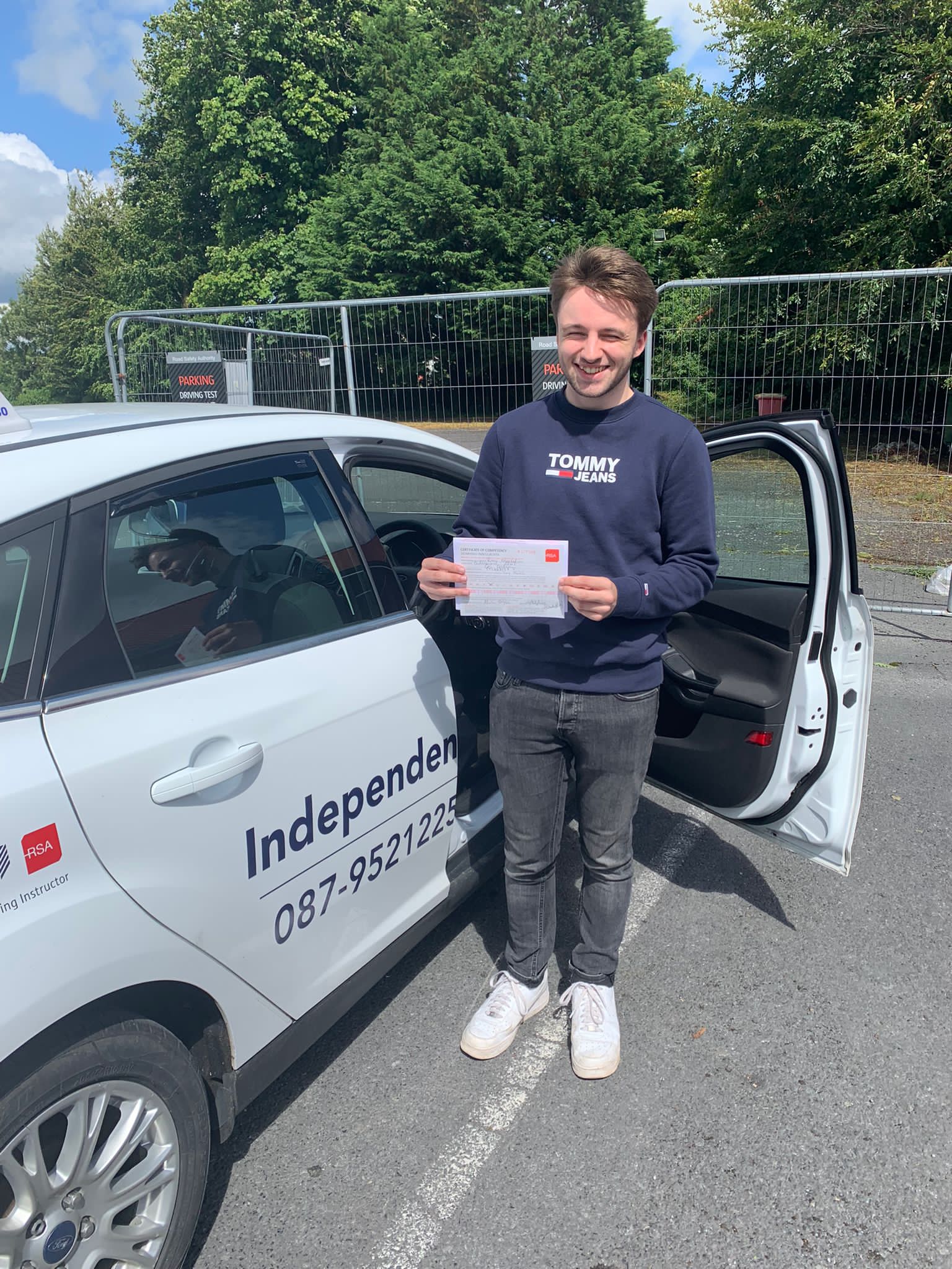 Student with driving test pass certificate