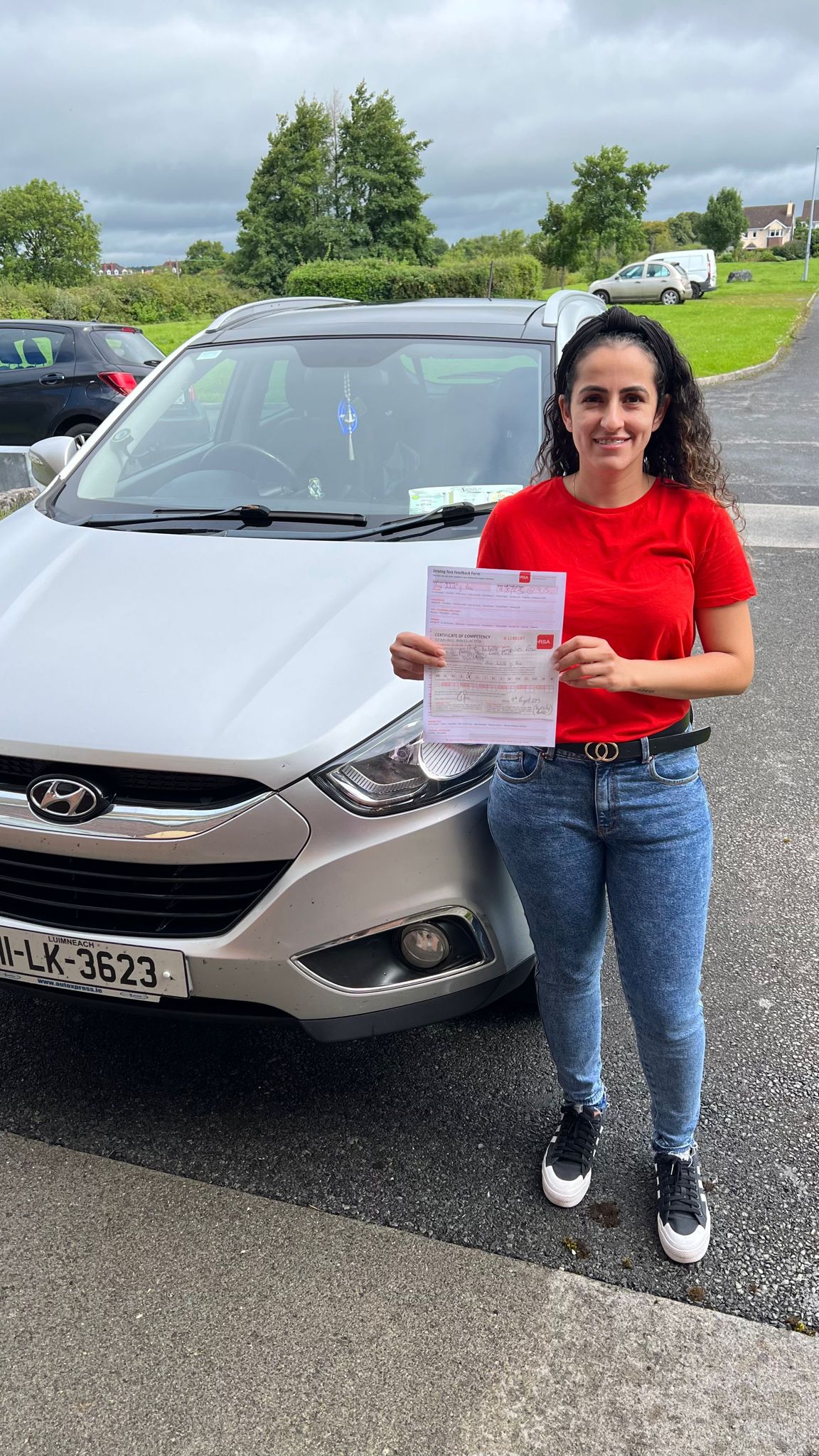 Student with driving test pass certificate