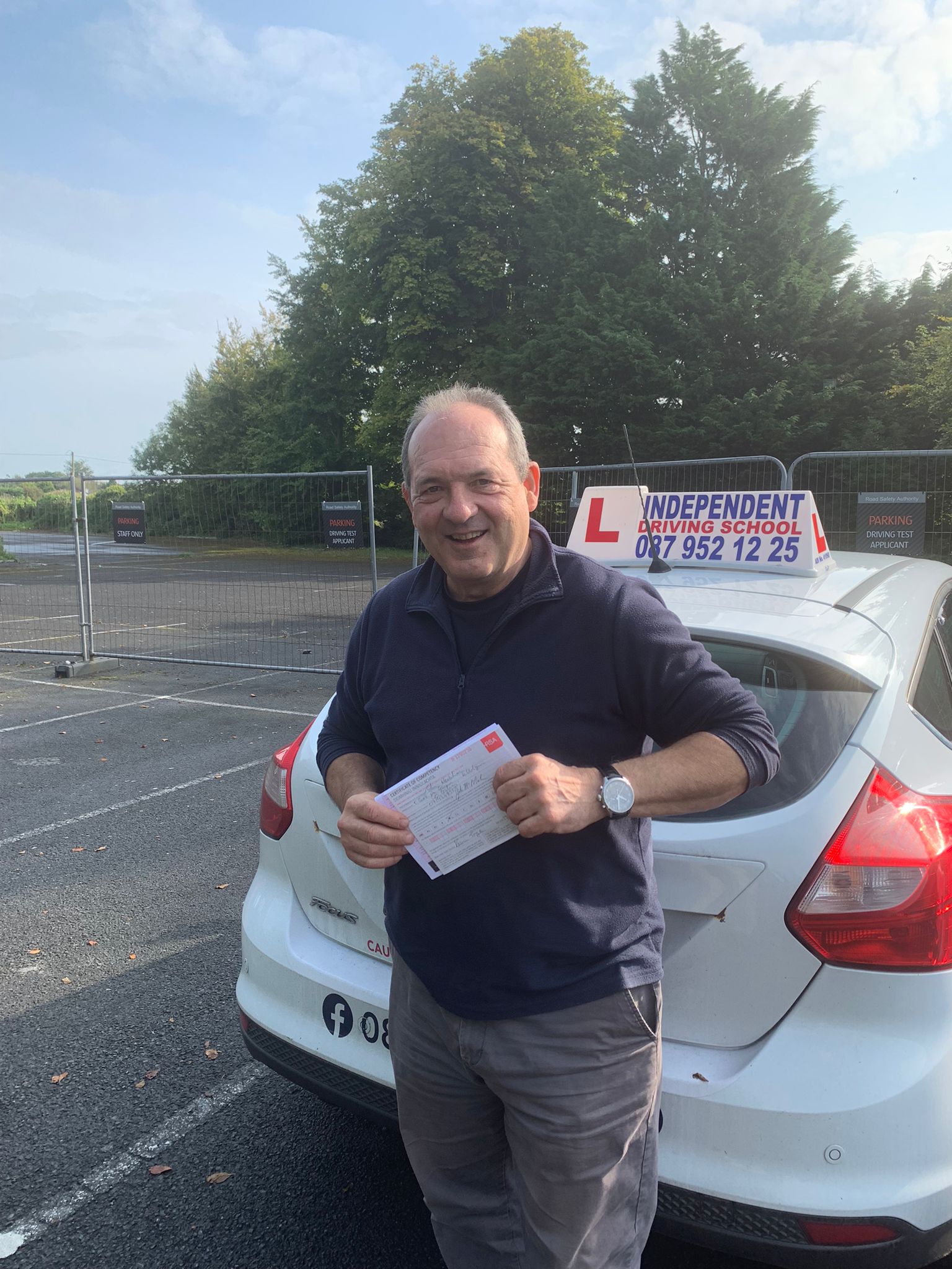 Student with driving test pass certificate