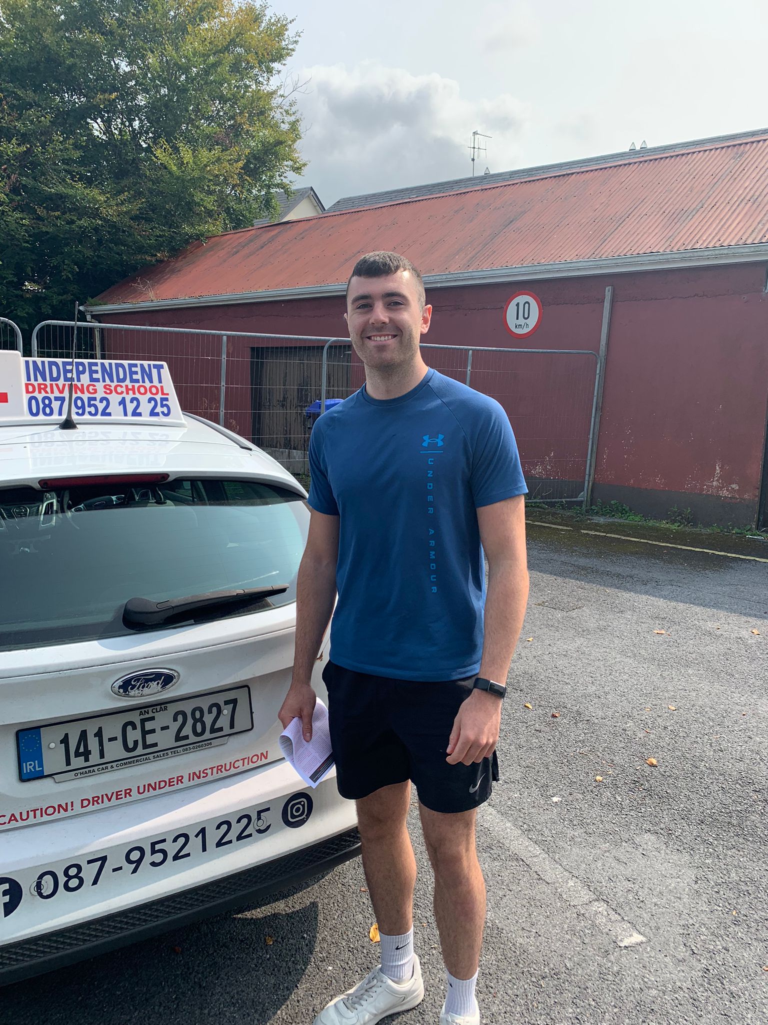 Student with driving test pass certificate