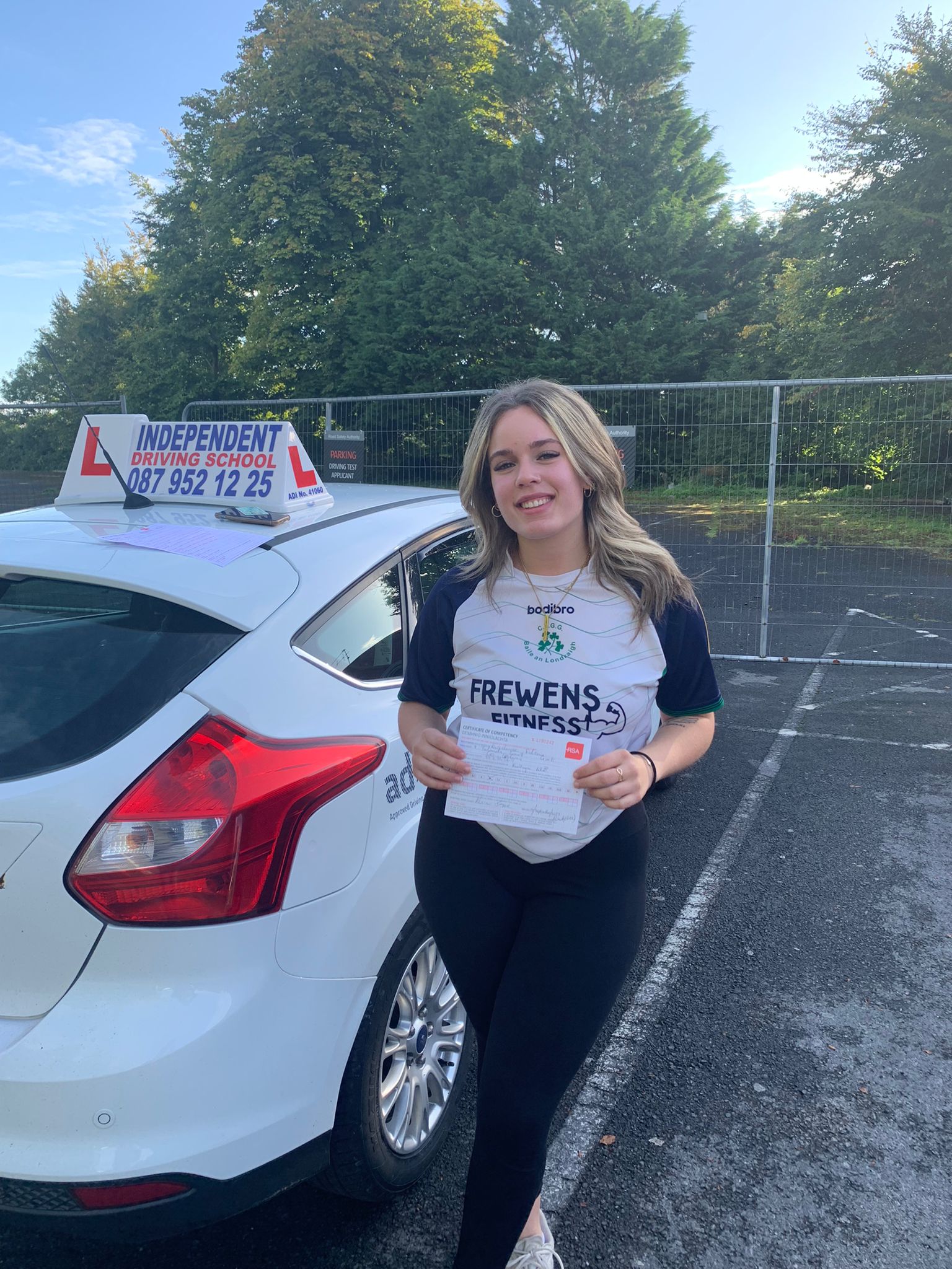Student with driving test pass certificate