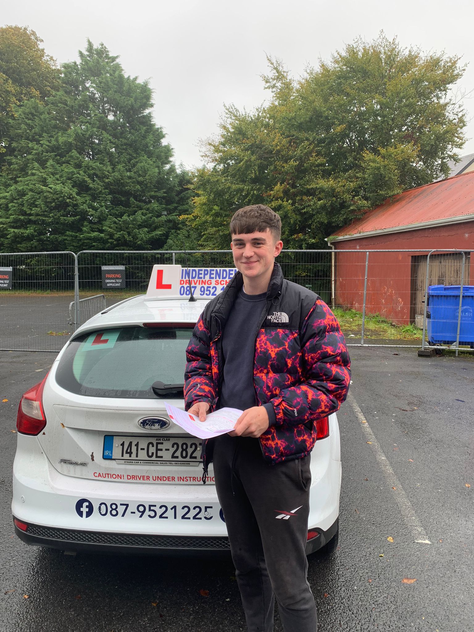Student with driving test pass certificate