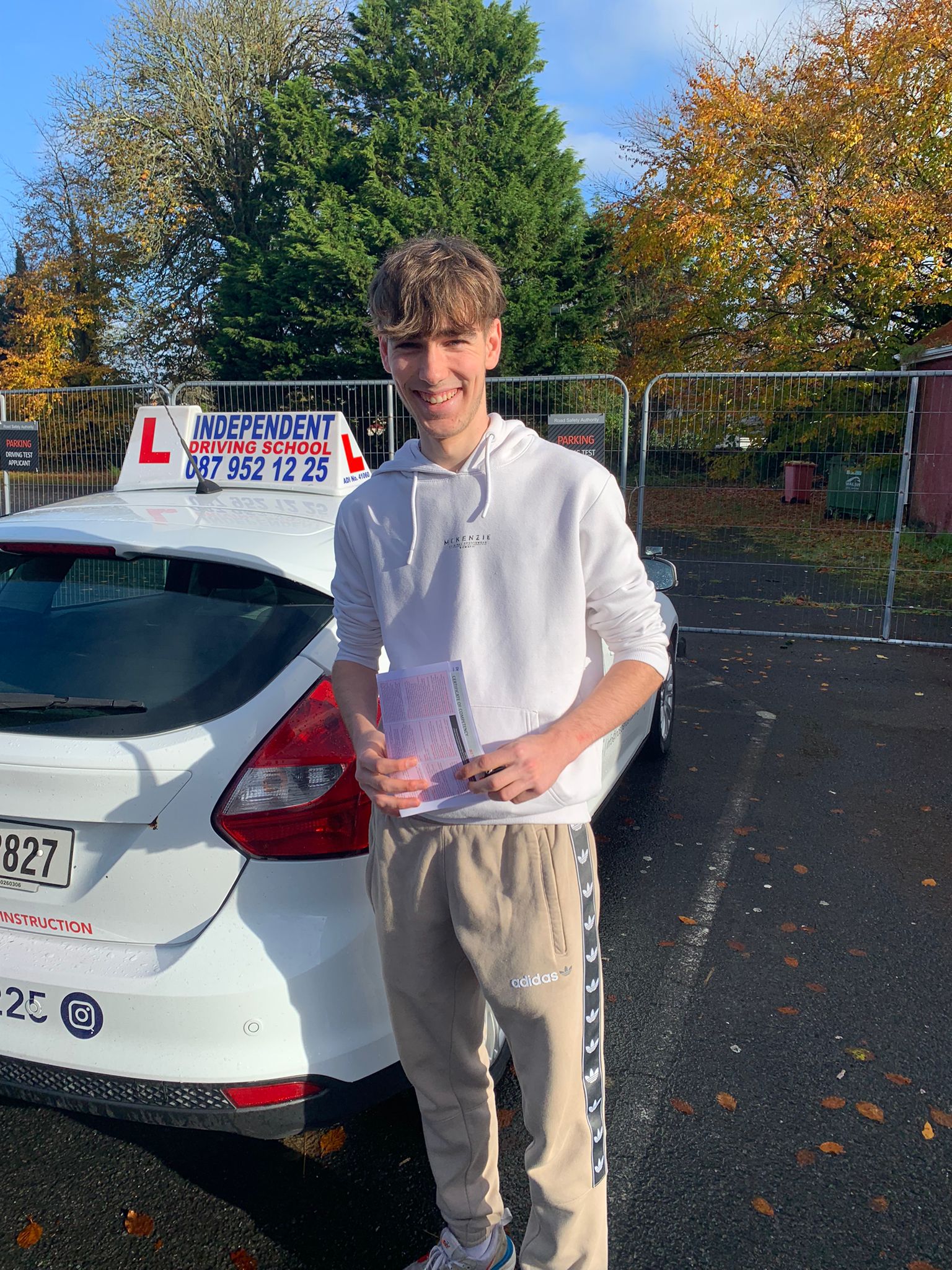 Student with driving test pass certificate