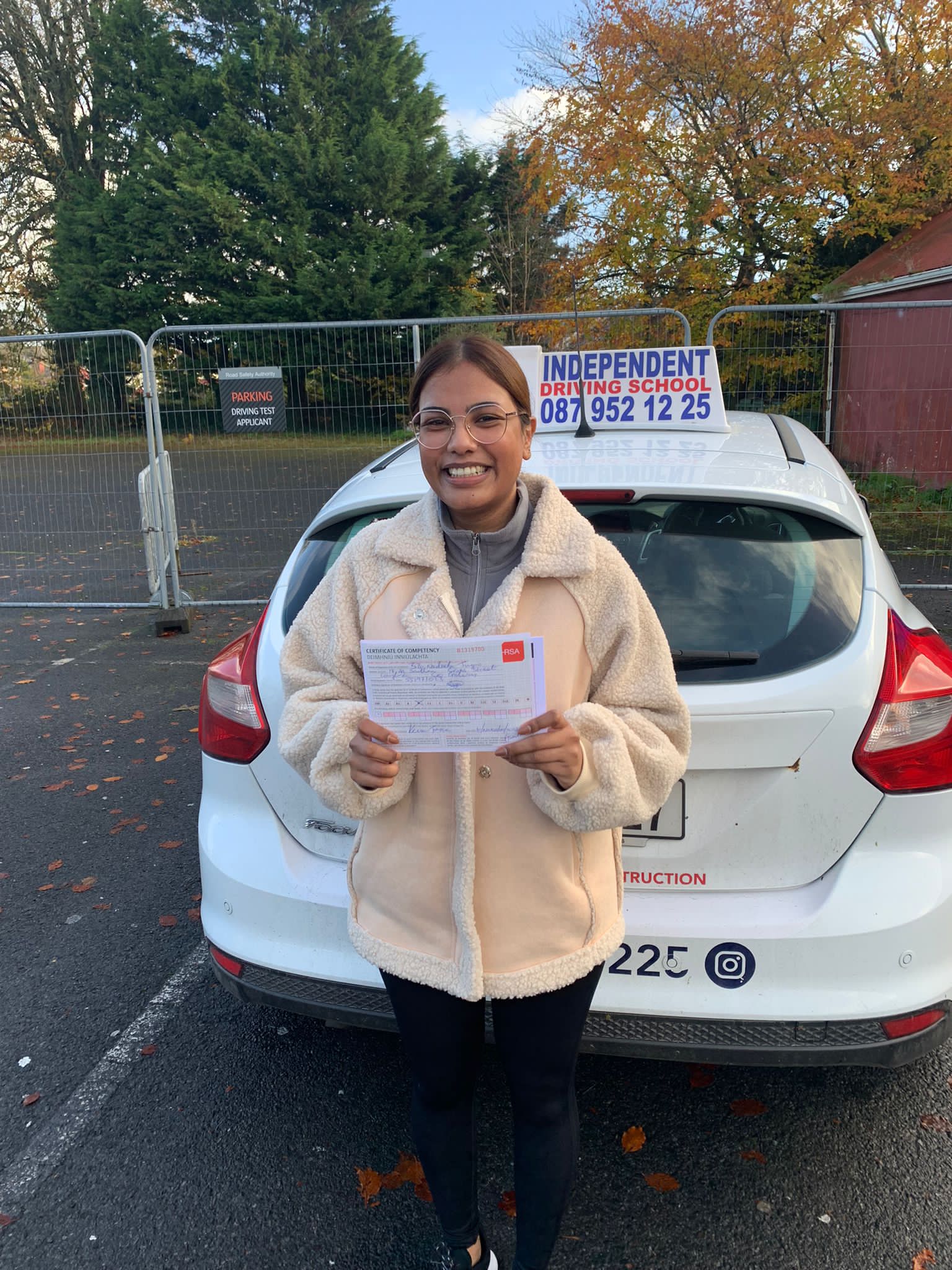 Student with driving test pass certificate