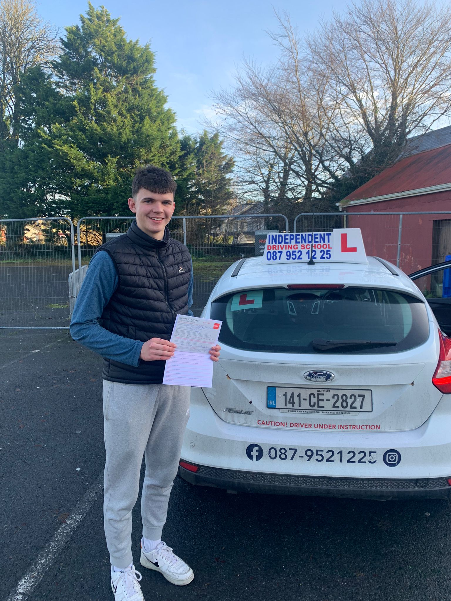 Student with driving test pass certificate