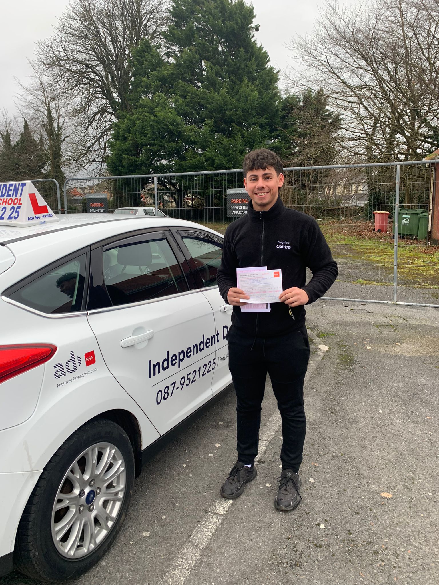 Student with driving test pass certificate