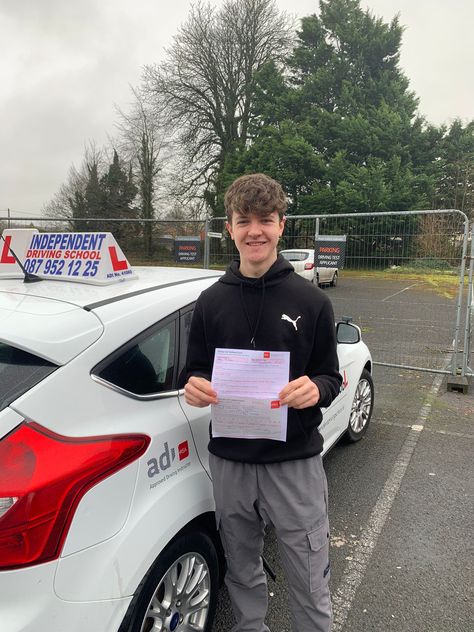 Student with driving test pass certificate