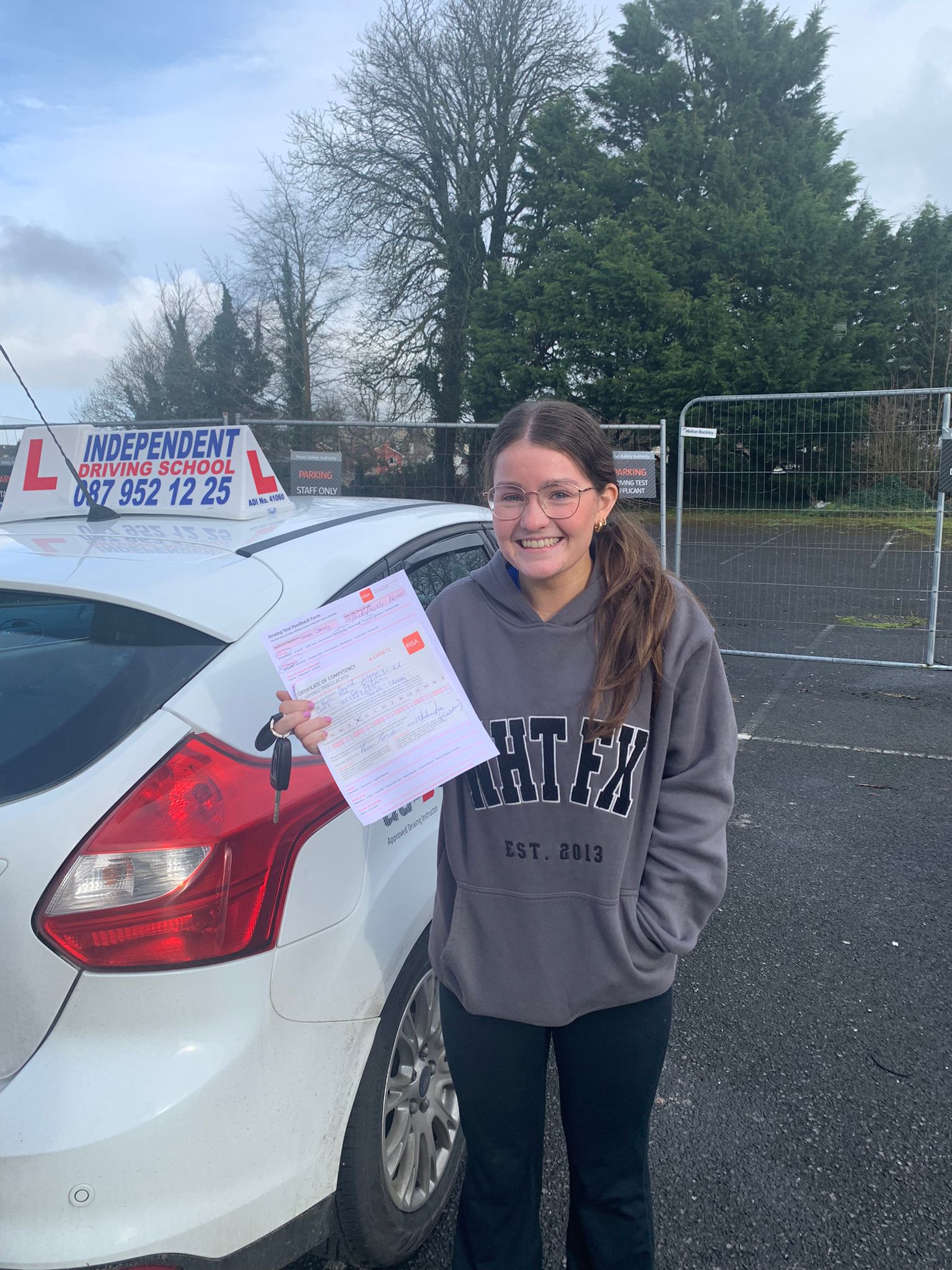 Student with driving test pass certificate