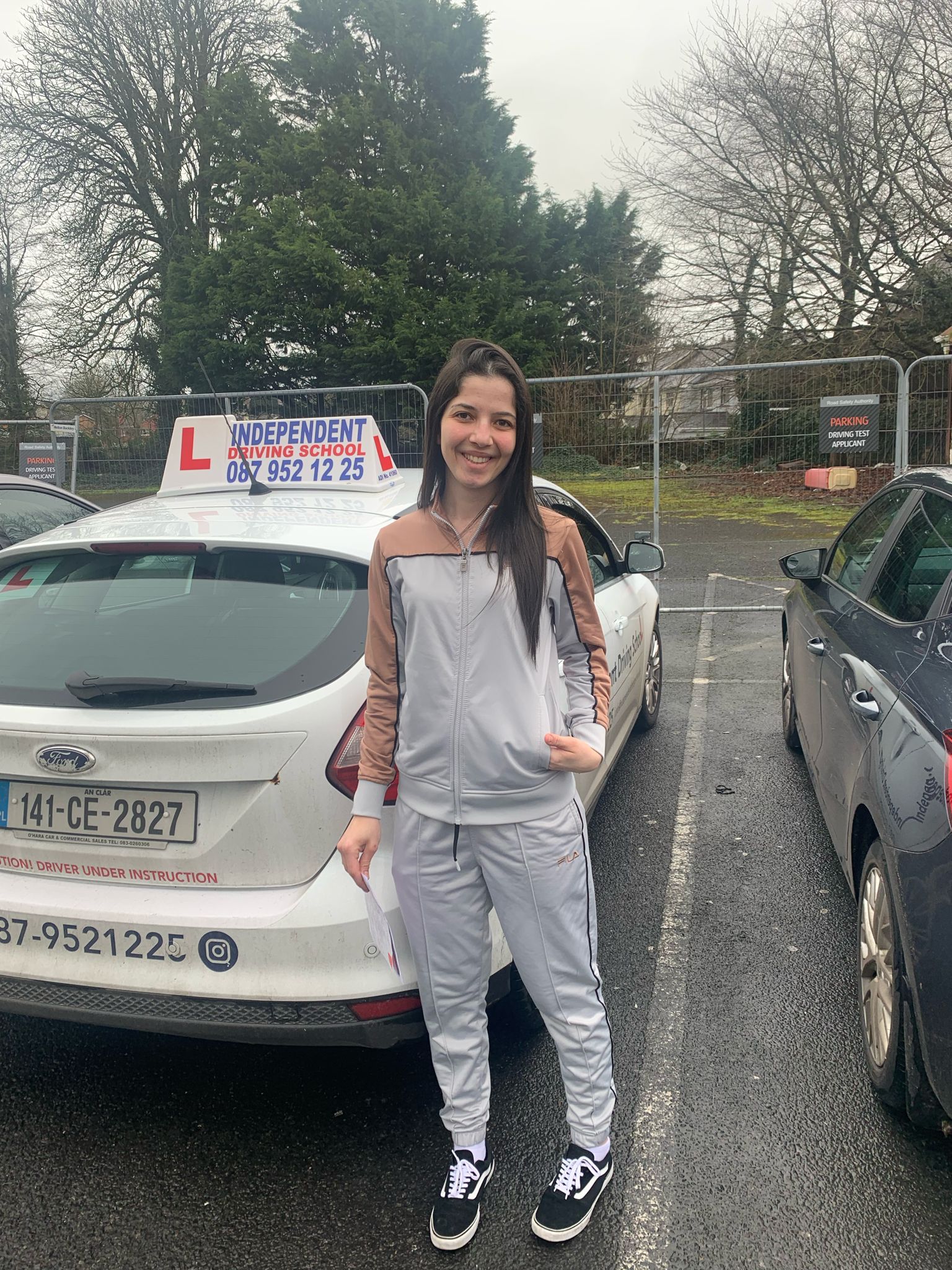 Student with driving test pass certificate