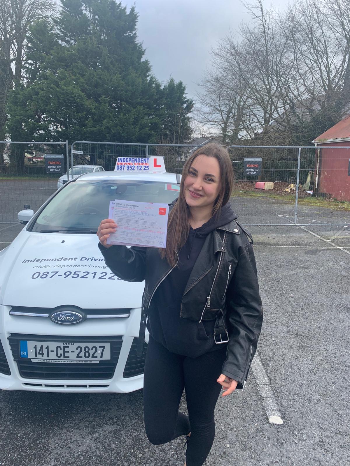 Student celebrating passing their driving test