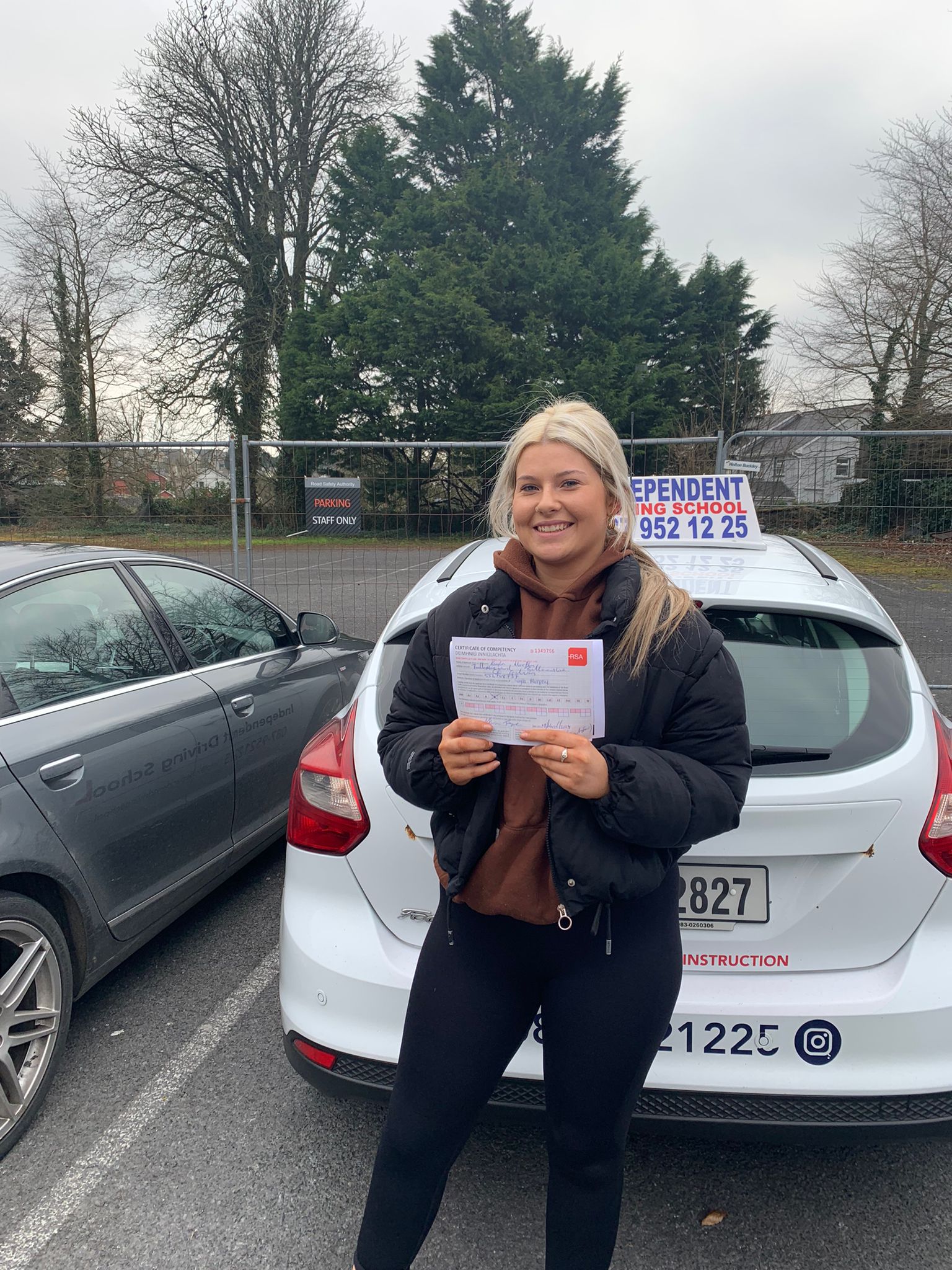 Student with driving test pass certificate