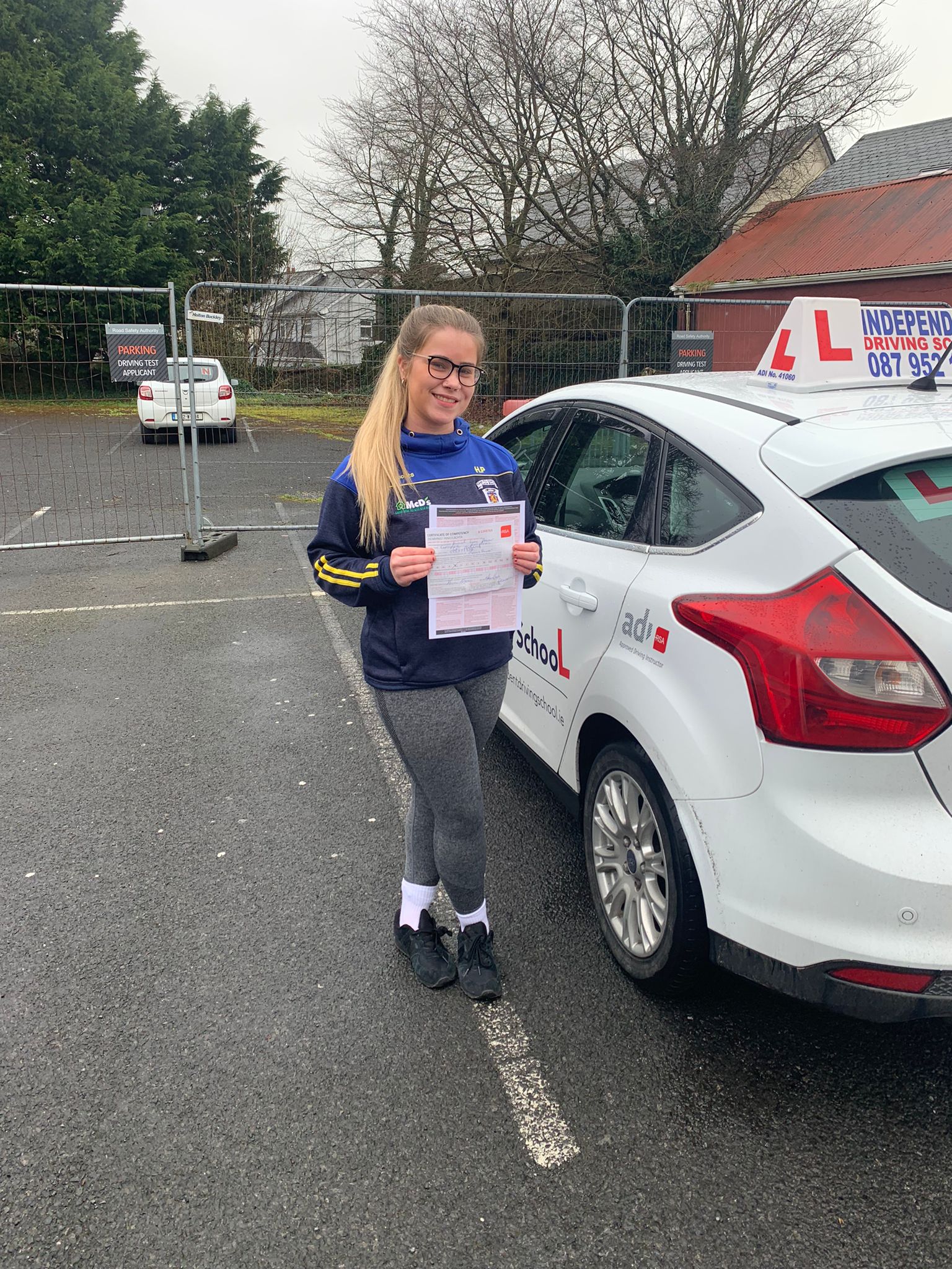 Student with driving test pass certificate